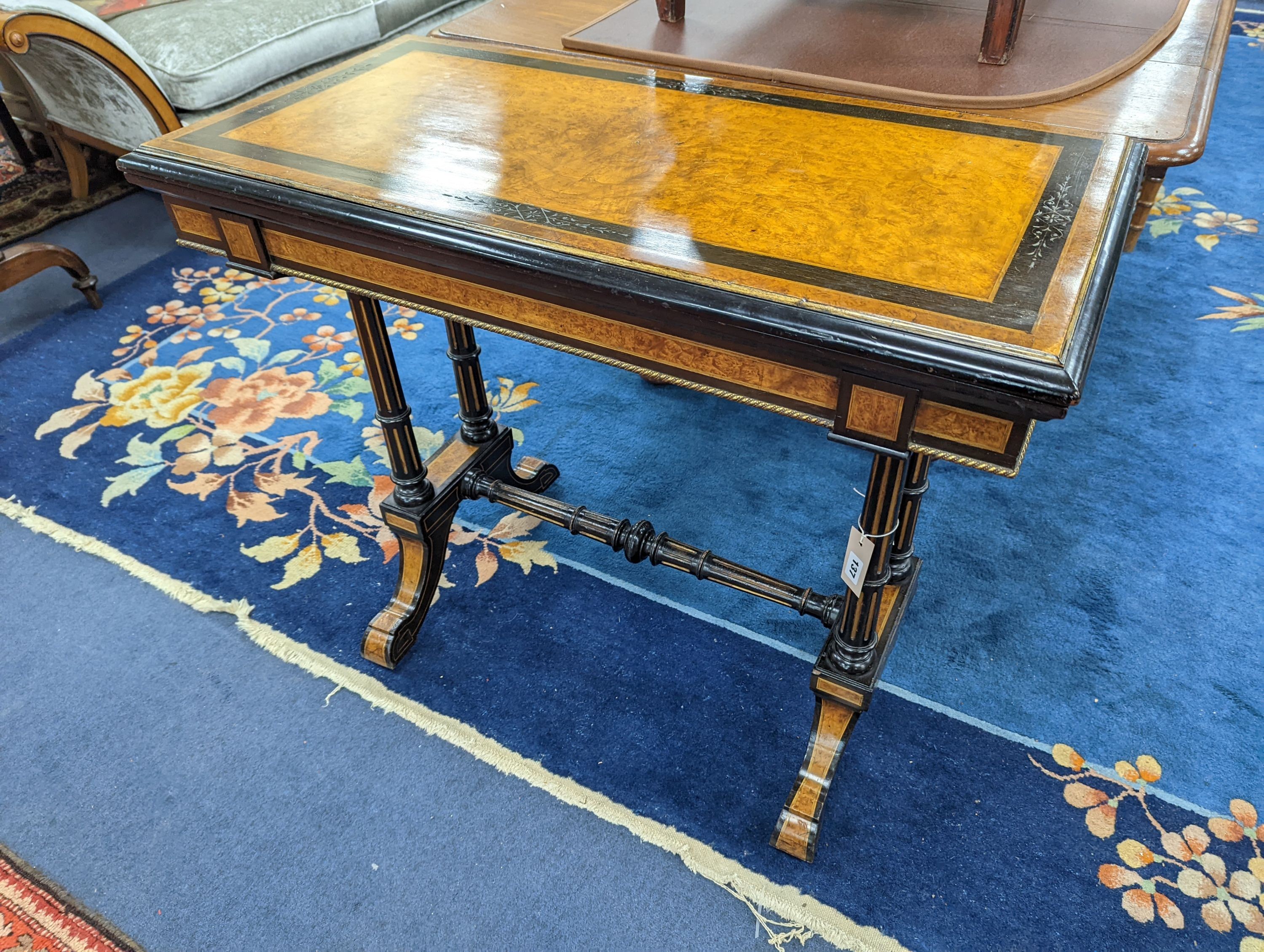 A Victorian part ebonised rectangular Amboyna folding card table, width 91cm, depth 46cm, height 77cm